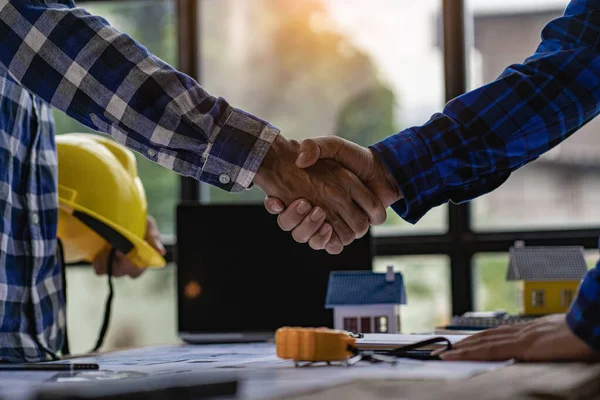 depositphotos 609533222 stock photo architects construction engineers shake hands